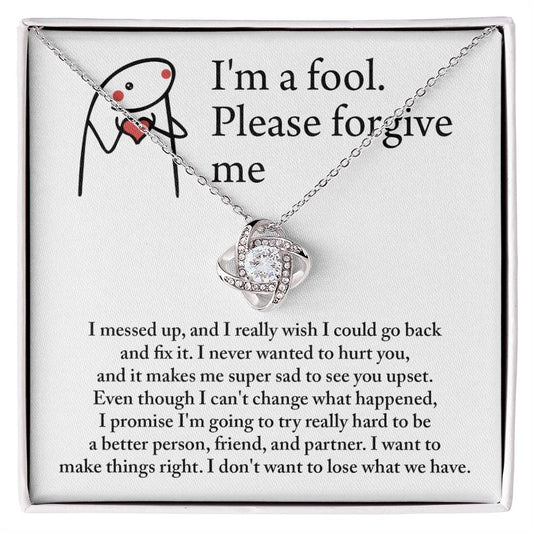 The "Sorry, Make Things Right - Love Knot Necklace," adorned with cubic zirconia crystals and elegantly displayed in a gift box, features a 14k white gold pendant that comes with a heartfelt apology message, asking for forgiveness and expressing deep regret for causing hurt.