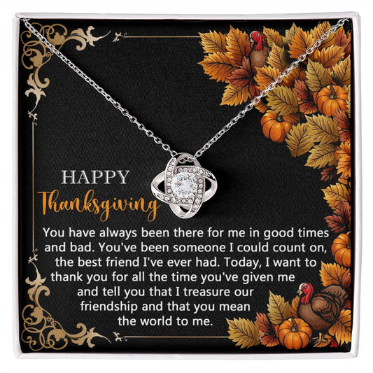 The Thanksgiving-Count On - Love Knot Necklace, featuring a gold finish, is elegantly displayed on a card with a Thanksgiving message. The card is decorated with autumn leaves and an adorable turkey illustration. This intricately designed necklace, adorned with sparkling cubic zirconia, symbolizes endless love and gratitude.