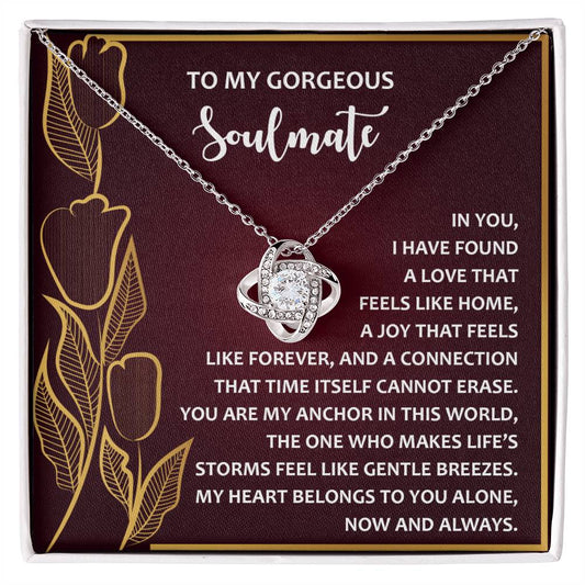 The Soulmate-Gentle Breezes Love Knot Necklace, adorned with cubic zirconia crystals, comes on a floral gift card and features a heartfelt message about love and connection, making it the perfect personalized gift.