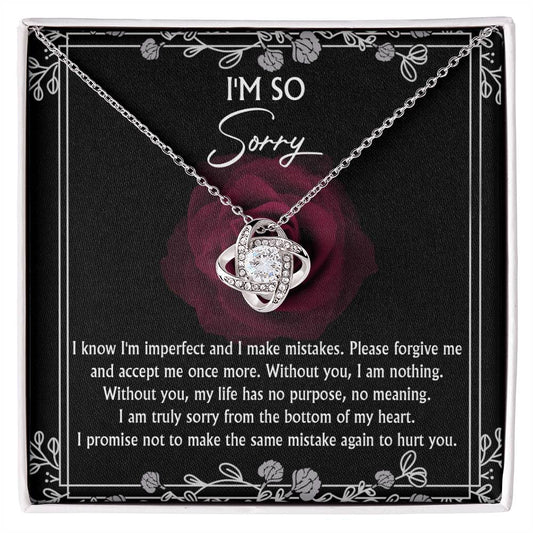 The Sorry-I Am Nothing - Love Knot Necklace in silver, featuring an intertwined knot design, is displayed on a card with a large rose and the text: "I'm so sorry. I know I'm imperfect and I make mistakes. Please forgive me and accept me once more...