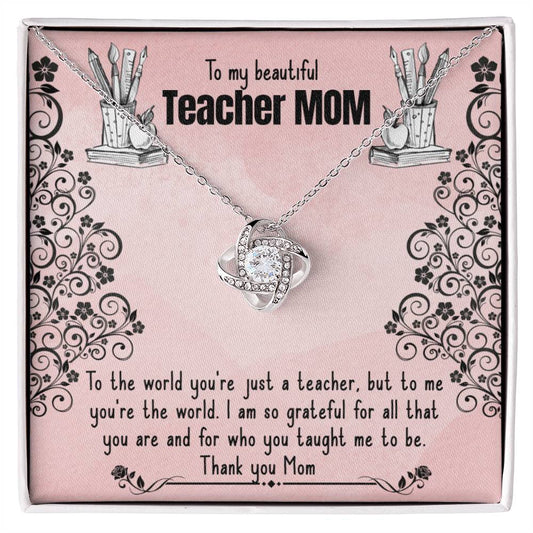 An ornamental ShineOn Fulfillment Love Knot Necklace with cubic zirconia crystals is displayed on a card with a floral design, alongside a heartfelt message dedicated to a "teacher mom," expressing gratitude and admiration.