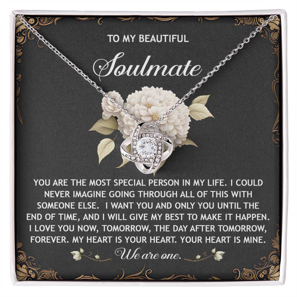 The Soulmate-We Are One - Love Knot Necklace is beautifully presented in a floral box with sparkling cubic zirconia crystals, showcasing touching text to express love for a soulmate.