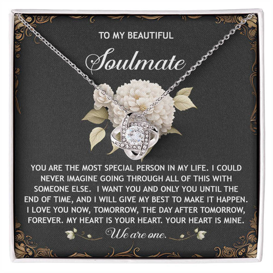 The Soulmate-We Are One - Love Knot Necklace is beautifully presented in a floral box with sparkling cubic zirconia crystals, showcasing touching text to express love for a soulmate.