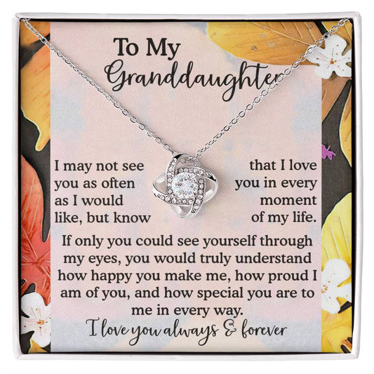 The Granddaughter-In Every Way - Love Knot Necklace, beautifully accented with cubic zirconia crystals, is presented on a heartfelt message card for a granddaughter.