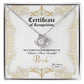 A To Bride, Certificate Of Achievement - Love Knot Necklace with a diamond-studded pendant is inside a box labeled "Certificate of Recognition" with text declaring "World's Most Beautiful Bride" and a space for names "You bring me" and "From." The pendant, set in 14k white gold, sparkles brilliantly.