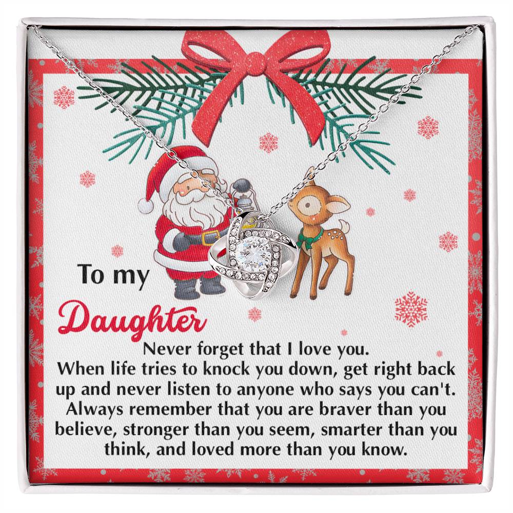 This personalized gift, the Daughter-Get Back Up Love Knot Necklace, comes on a card beautifully decorated with Santa and his reindeer. It includes the heartfelt message: "To my Daughter, never forget that I love you..." along with an empowering motivational text. The necklace is adorned with cubic zirconia crystals, symbolizing our everlasting bond.