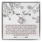 Introducing the "Sorry-Your Big Heart - Love Knot Necklace": This exquisite white gold necklace showcases an elegant intertwined heart design, adorned with shimmering cubic zirconia crystals. It comes complete with a heartfelt card that reads, "I am Sorry," followed by an apologetic message. The entire set is beautifully presented in a floral-printed box.
