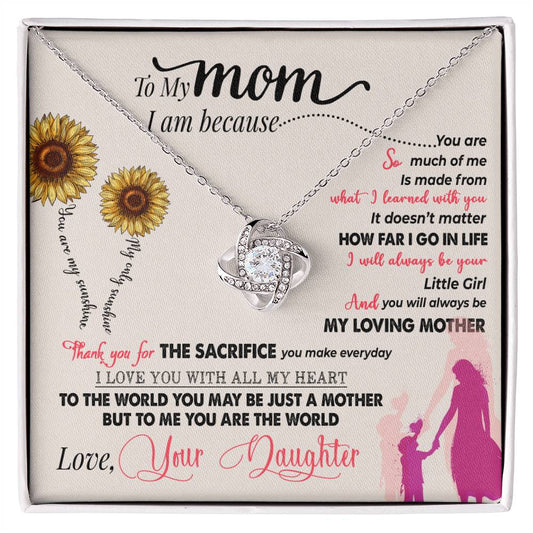 A gift box containing a heart-shaped To My Mom, Thank You For Everything - Love Knot Necklace with a touching written message from a daughter to her mother, featuring cubic zirconia and a gold finish by ShineOn Fulfillment.