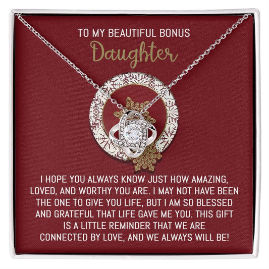 The Bonus Daughter-Always Will Be - Love Knot Necklace, featuring shimmering cubic zirconia crystals, is beautifully packaged in a gift box. It includes the heartfelt message "To My Beautiful Bonus Daughter," making it an ideal personalized gift to express your affection and connection.