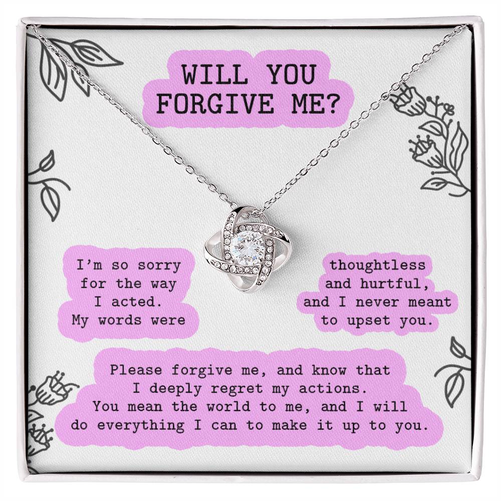 The "Sorry-Never Meant To - Love Knot Necklace," featuring a pendant adorned with sparkling cubic zirconia crystals, is displayed in a box. The box includes an apology message asking for forgiveness, expressing regret for hurtful words, and a promise to make amends, symbolizing the enduring bond between you two through this personalized gift.