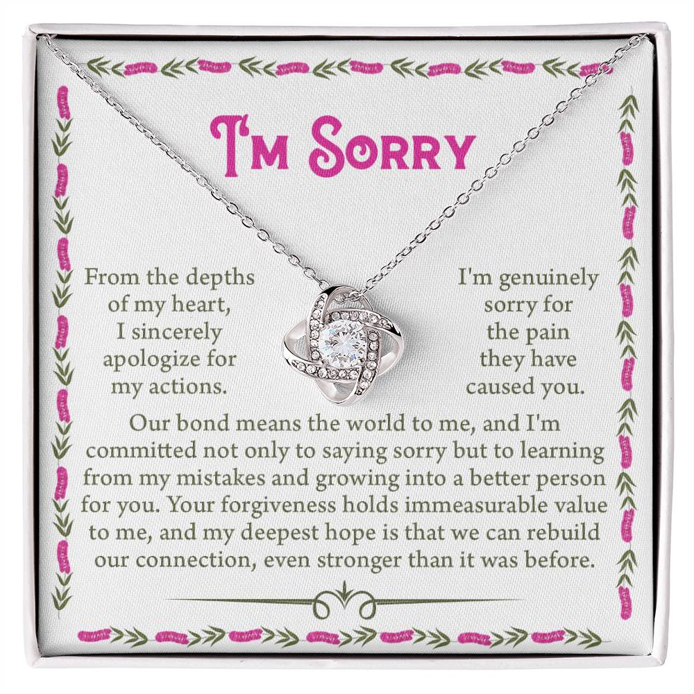 The Sorry-A Better Person - Love Knot Necklace features an intertwined heart pendant adorned with premium cubic zirconia crystals, presented on a card with an apologetic message expressing deep remorse and a desire for forgiveness and improved connection.