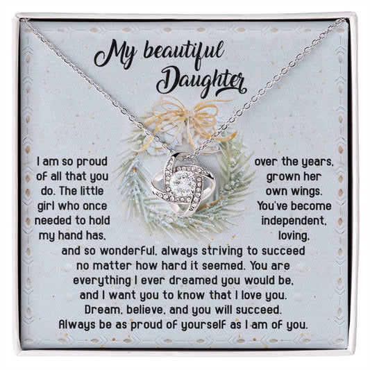 The Daughter-Proud Of Yourself - Love Knot Necklace serves as a personalized gift, beautifully presented on a display card featuring an inspirational message for a daughter. Embellished with delicate floral and ribbon design elements, it gleams with cubic zirconia crystals, creating a meaningful keepsake of love and affection.