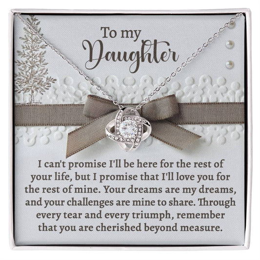 The Daughter-Mine To Share - Love Knot Necklace is a personalized gift that comes in a gift box featuring a heartfelt message for a daughter about love and support, adorned with dazzling Cubic Zirconia Crystals.