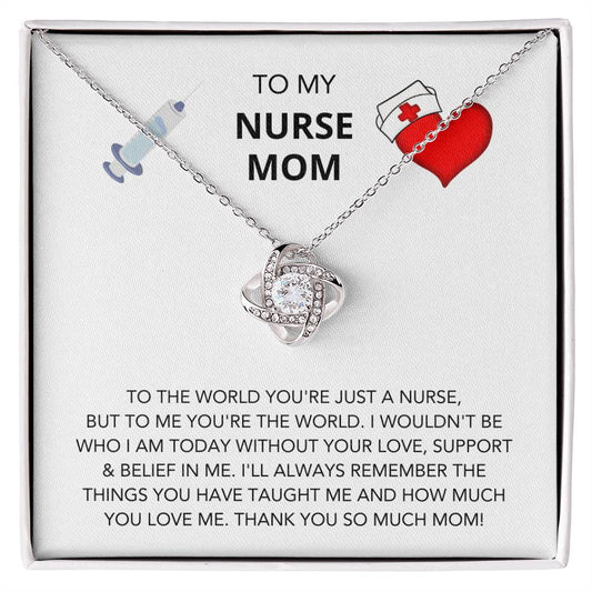 A 'To My Nurse Mom, To The World You're Just A Nurse' Love Knot Necklace with a heart-shaped pendant, adorned with cubic zirconia crystals and a medical cross charm, is displayed in a gift box with a message expressing love and appreciation for a mother who.