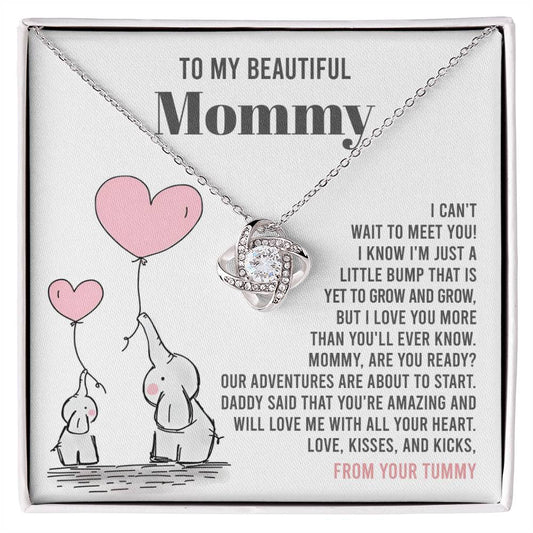A "To Mama To Be, All Your Heart - Love Knot Necklace" from ShineOn Fulfillment presented on a card with a sentimental message for an expectant mother from her unborn child.