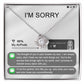The "Sorry-Breaks My Soul - Love Knot Necklace" is a silver necklace featuring a pendant, beautifully displayed in its packaging. The front of the packaging includes a heartfelt apology message, text messages, a battery icon showing 96% for AirPods, and an illustrated figure. This intricately crafted piece is made from 14k white gold and adorned with cubic zirconia crystals.
