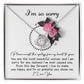 The Sorry-Make You Happy - Love Knot Necklace features a heart-shaped pendant adorned with cubic zirconia crystals, presented in a box decorated with pink flowers and the heartfelt text "I'm so sorry" at the top.