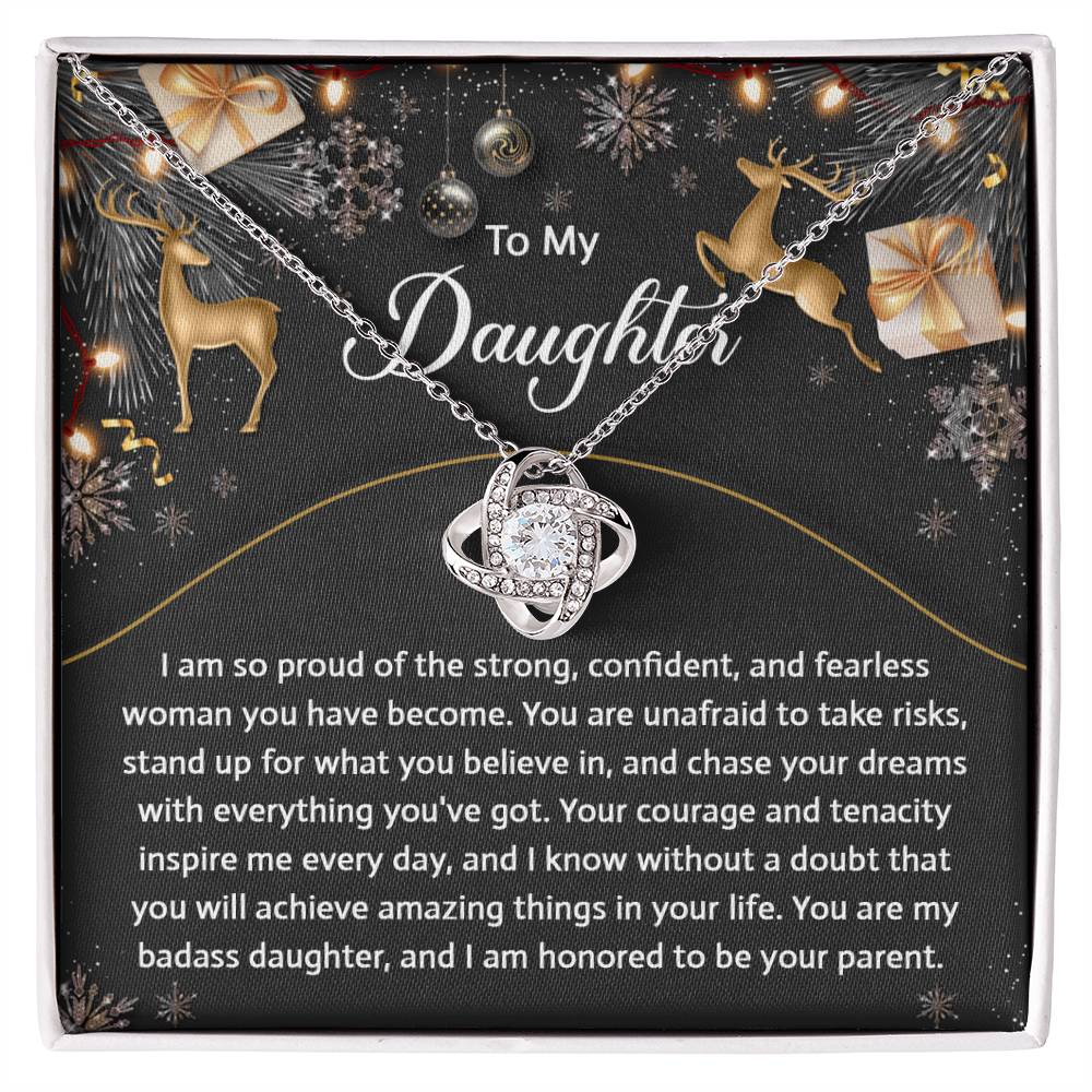 A Daughter-Amazing Things Love Knot Necklace and ring set comes elegantly displayed in a box adorned with cubic zirconia crystals. Inside the box, a heartfelt message addressed "To My Daughter" is beautifully accompanied by decorative reindeer and gift boxes, making it an ideal personalized gift.