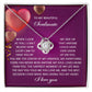 The Soulmate-My Soul Love Knot Necklace, an elegant silver heart-shaped piece adorned with cubic zirconia crystals, is presented on a purple card with a romantic message for your soulmate. Choose between a white gold or yellow gold finish to make it truly special.