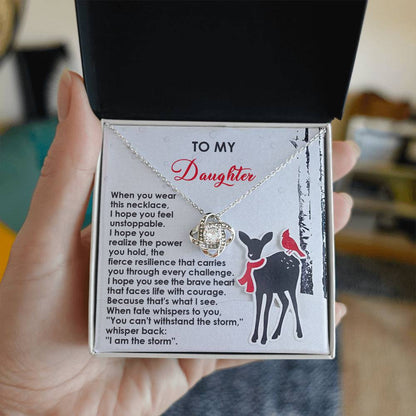 A Daughter-Every Challenge - Love Knot Necklace presented in a box with a message card that reads "To My Daughter," showcasing an illustration of a deer and two birds. Adorned with shimmering Cubic Zirconia Crystals, the card delivers an inspiring message about resilience and the unbreakable bond you share.