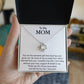 A "To My Mom, You Are The Sweetest Gift That God Has Ever Given Me" Love Knot Necklace is presented in a gift box with a heartfelt written message dedicated to "mom," expressing gratitude and love, adorned with cubic zirconia crystals by ShineOn Fulfillment.