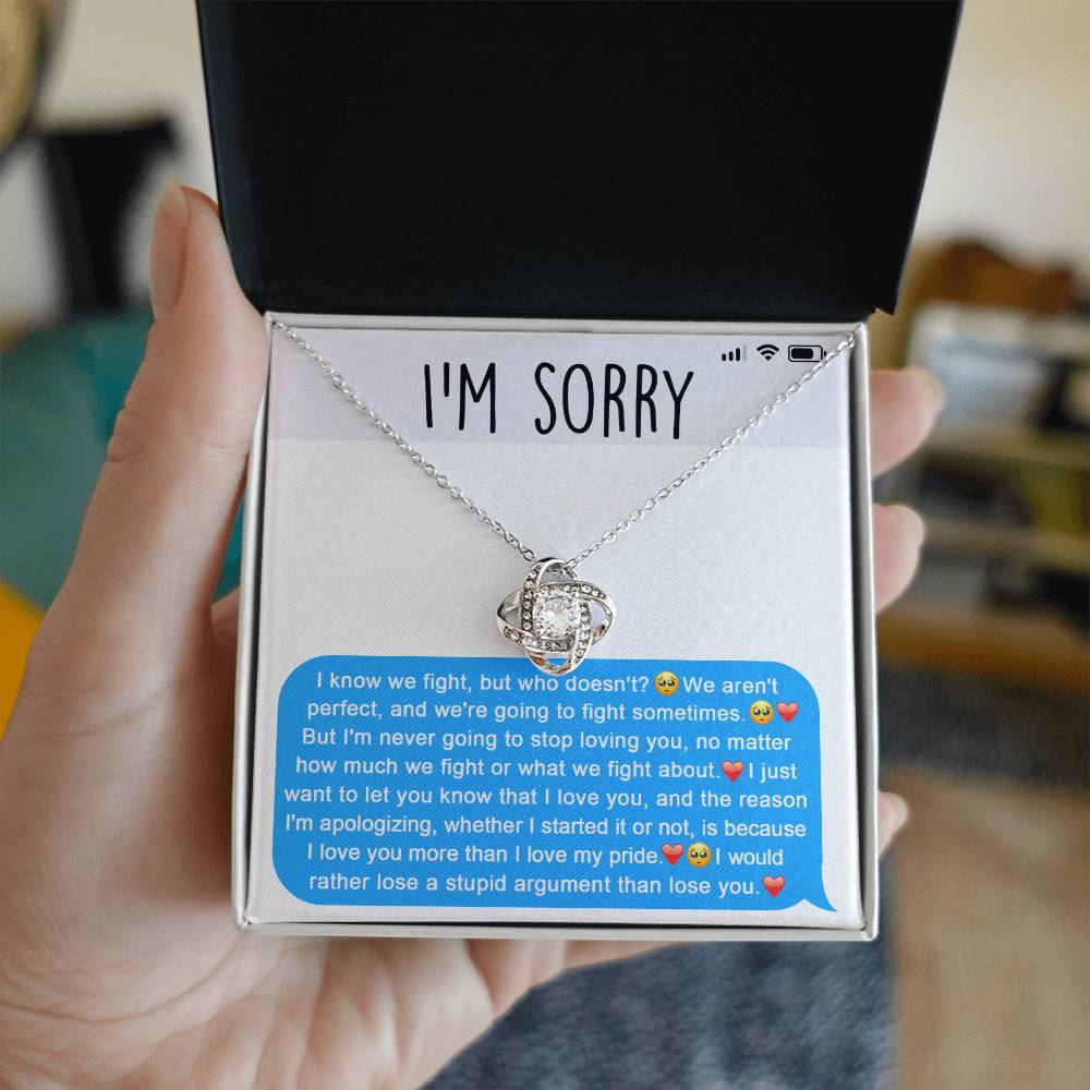 The Sorry-Stupid Argument - Love Knot Necklace, embellished with sparkling cubic zirconia crystals, is displayed above a heartfelt apology message. The message conveys love, regret over their argument, and a genuine desire to prioritize the relationship, making this personalized gift truly meaningful.