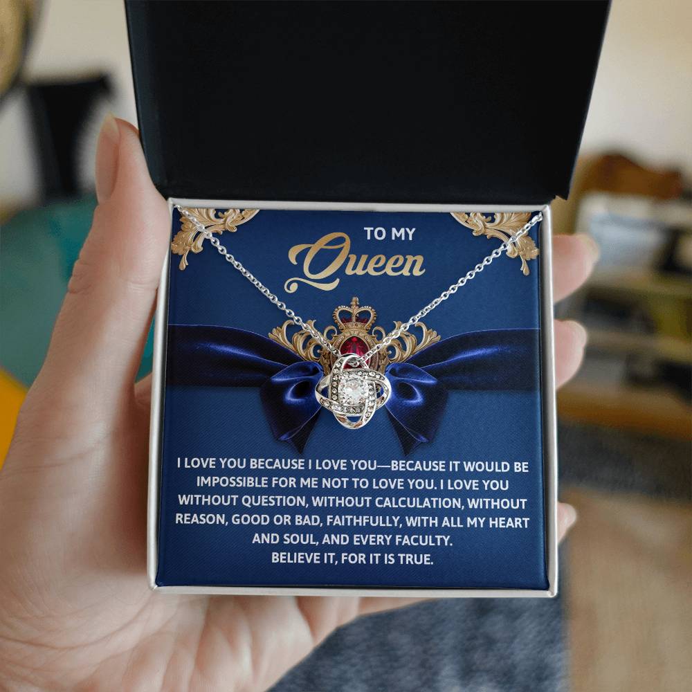 The Queen-Every Faculty Love Knot Necklace is showcased in an open box that reads "To my Queen" with a heartfelt message. Its gold finish and shimmering cubic zirconia crystals make it the perfect symbol of timeless elegance and love.