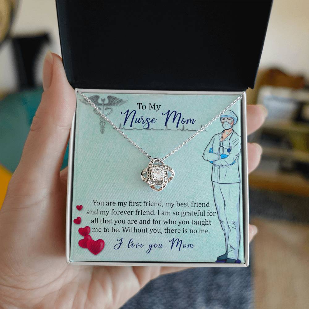 An open gift box displaying a "To My Nurse Mom, You Are My First Friend" Love Knot Necklace with cubic zirconia crystals, alongside a message card addressed to a "nurse mom" expressing love and gratitude.