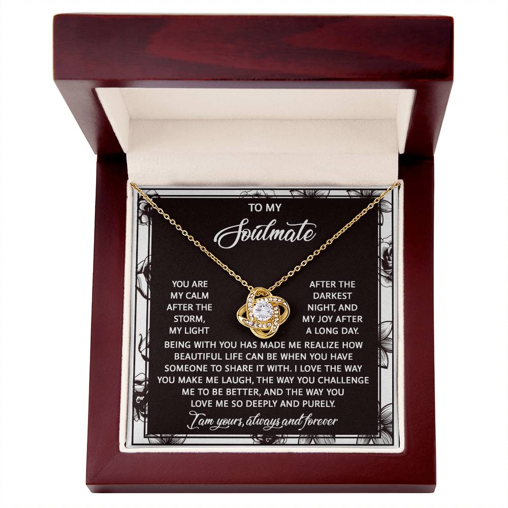 The "Soulmate-Deeply And Purely - Love Knot Necklace" features a circular pendant with cubic zirconia crystals, presented in an open jewelry box alongside a heartfelt message symbolizing an unbreakable bond.