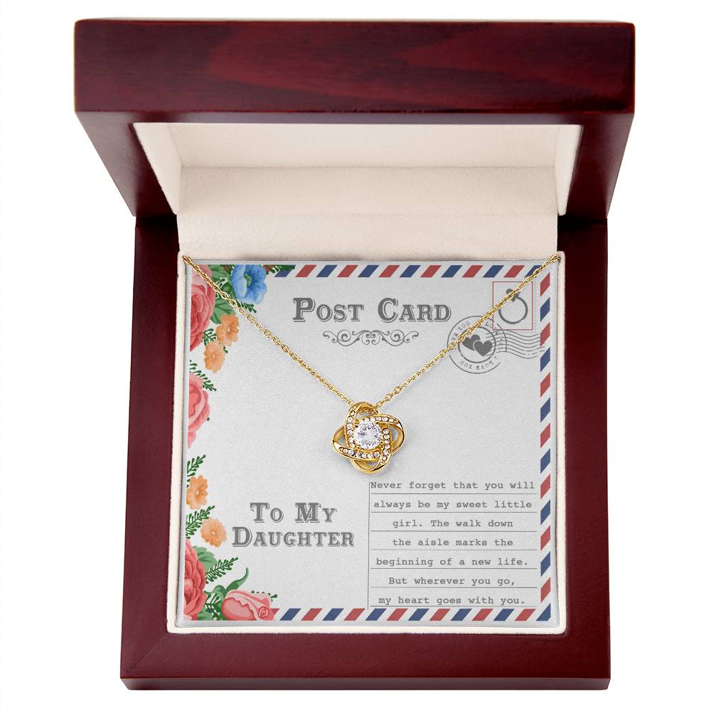 The "To Daughter, Goes With You - Love Knot Necklace," featuring an intertwining design with a gold finish and adorned with cubic zirconia crystals, is displayed on a postcard that reads "To My Daughter." The message includes a heartfelt note about your daughter's wedding and a mother's enduring love.