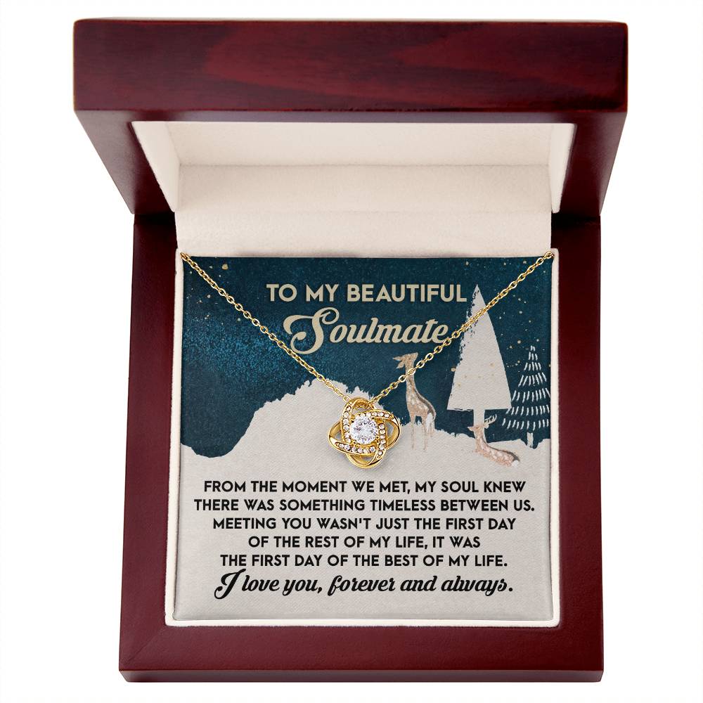 The Soulmate- Between Us - Love Knot Necklace, adorned with cubic zirconia crystals, is beautifully presented in a box. Inside, a message reads, "To my beautiful soulmate," alongside a heartfelt romantic note, making it an ideal personalized gift.