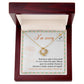 The "Sorry, Another Chance - Love Knot Necklace," featuring sparkling cubic zirconia crystals and crafted in 14k white gold, rests in a box. A note inside reads, "I'm sorry. Nothing is right in this world if I can't make this right. Please give me another chance to become a better version of myself. I love you and I am sorry, I truly am.