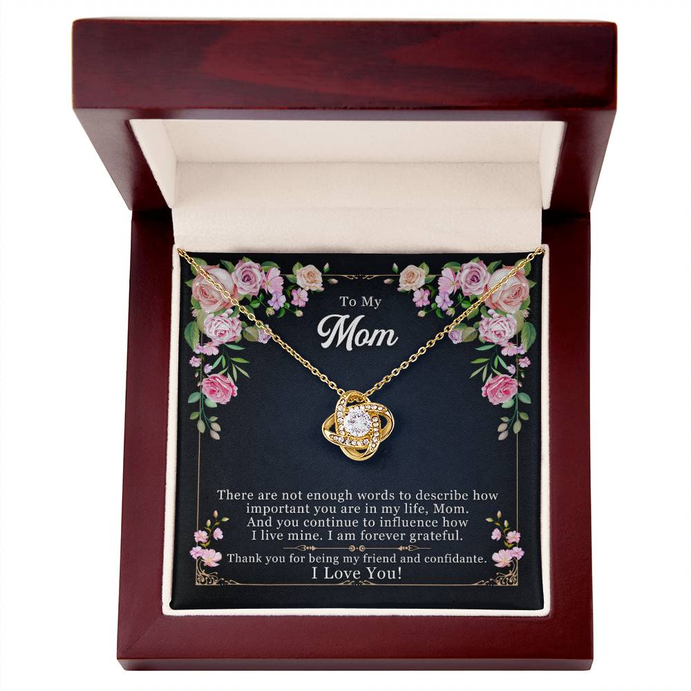 A "To My Mom, Thank yOU For Being My Friend" Love Knot Necklace with a heart-shaped pendant in a gift box with a message for a mother by ShineOn Fulfillment.