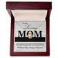 The "To Mom, Loving As You - Love Knot Necklace" adorned with cubic zirconia crystals is beautifully displayed inside an open wooden box. The lid of the box features a heartfelt message beginning with "To My Loving MOM" and ending with "I Love You, always & forever." This personalized gift elegantly captures eternal love.