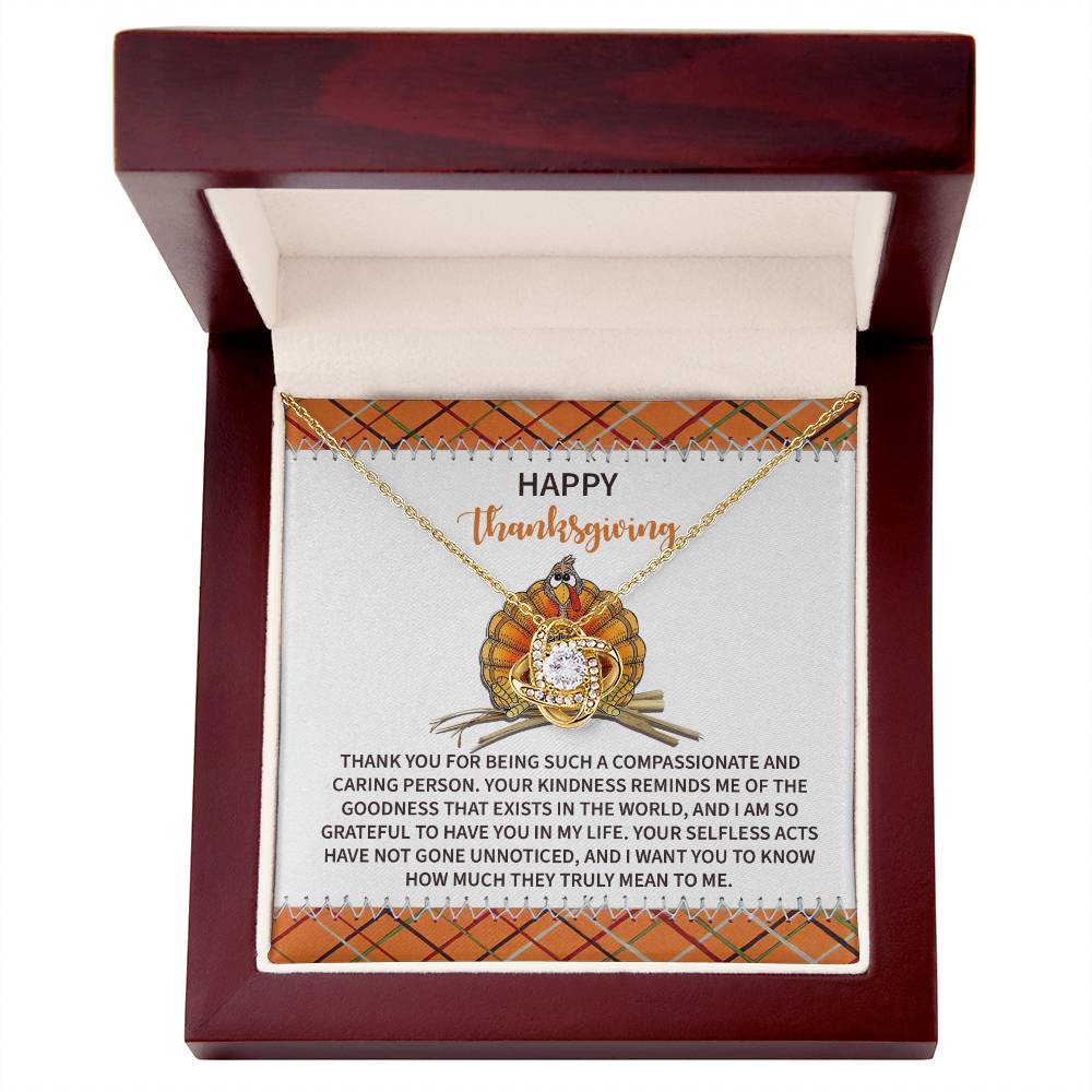 The Thanksgiving-In My Life - Love Knot Necklace graced with Cubic Zirconia Crystals is elegantly displayed in a jewelry box that showcases a Thanksgiving message and a festive design on the inside lid. This personalized gift beautifully embodies the spirit of gratitude with style.