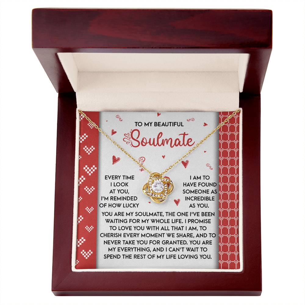 The Soulmate-My Whole Life - Love Knot Necklace elegantly rests in a red-lined jewelry box, featuring a circular pendant adorned with cubic zirconia. This personalized gift, including a heartfelt message to a soulmate, makes it the perfect expression of love.