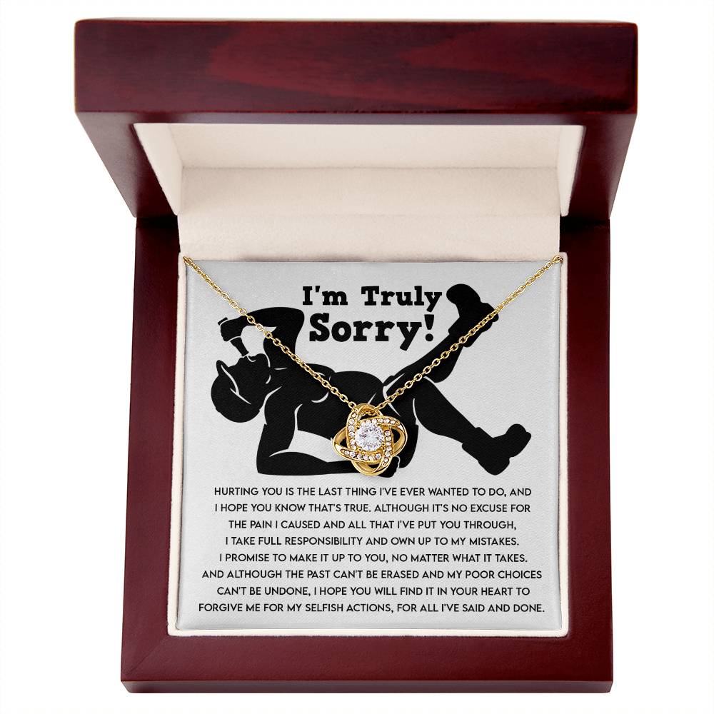 The "Sorry-Selfish Actions - Love Knot Necklace" with shimmering cubic zirconia crystals on a white background features a heartfelt apology that reads: "I'm Truly Sorry! Hurting you is the last thing I've ever wanted to do... I hope you will find it in your heart to forgive me.