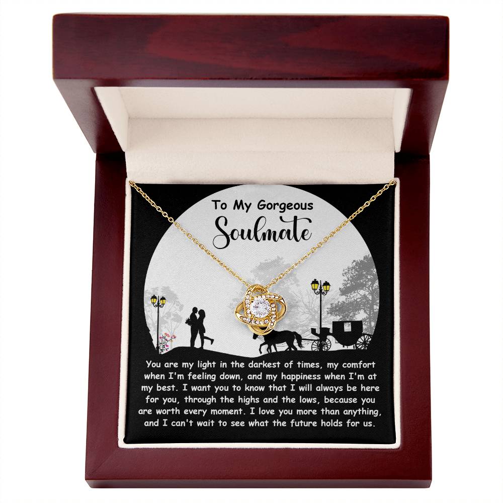 The Soulmate-Holds For Us Love Knot Necklace features a gold finish pendant in a wooden box with a romantic note, making it perfect for your soulmate.