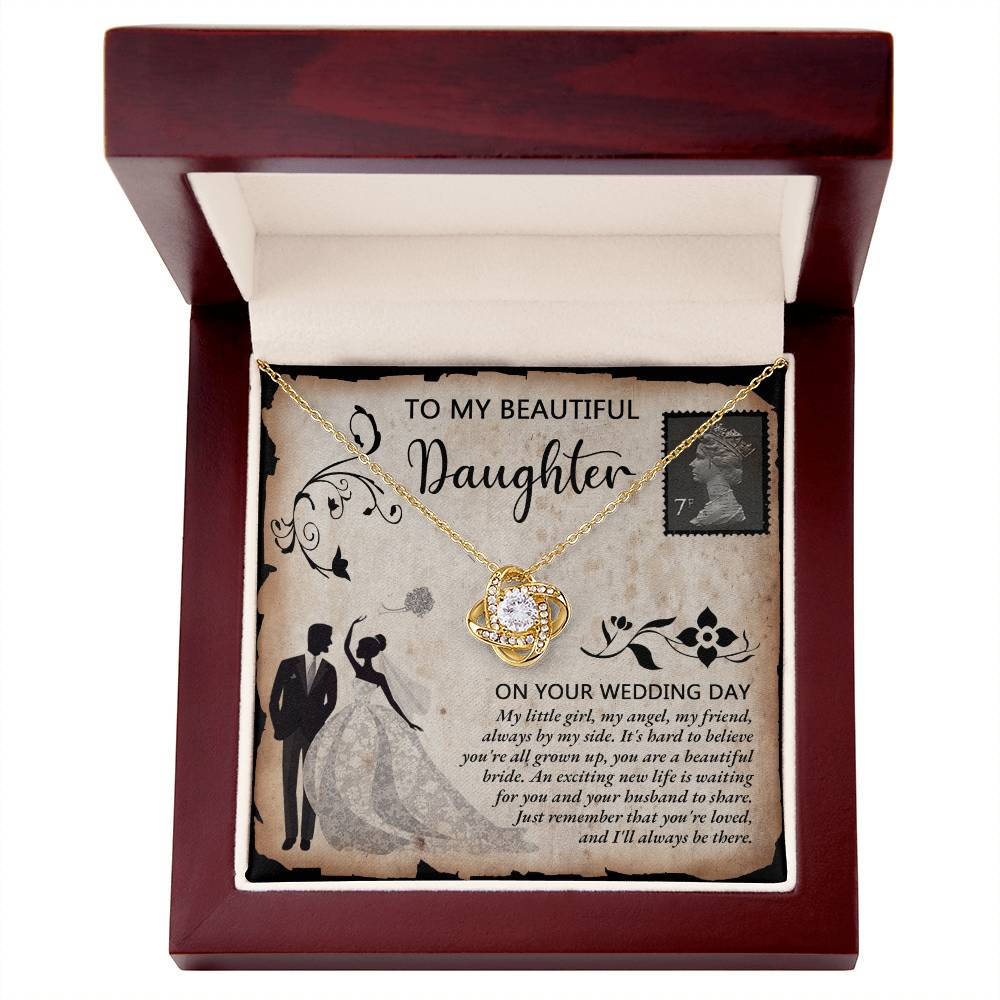 A silver To Daughter Wedding, Beautiful Bride - Love Knot Necklace adorned with cubic zirconia crystals on a card featuring an illustrated bride and groom. The card reads "To my beautiful daughter on your wedding day" with a heartfelt message.