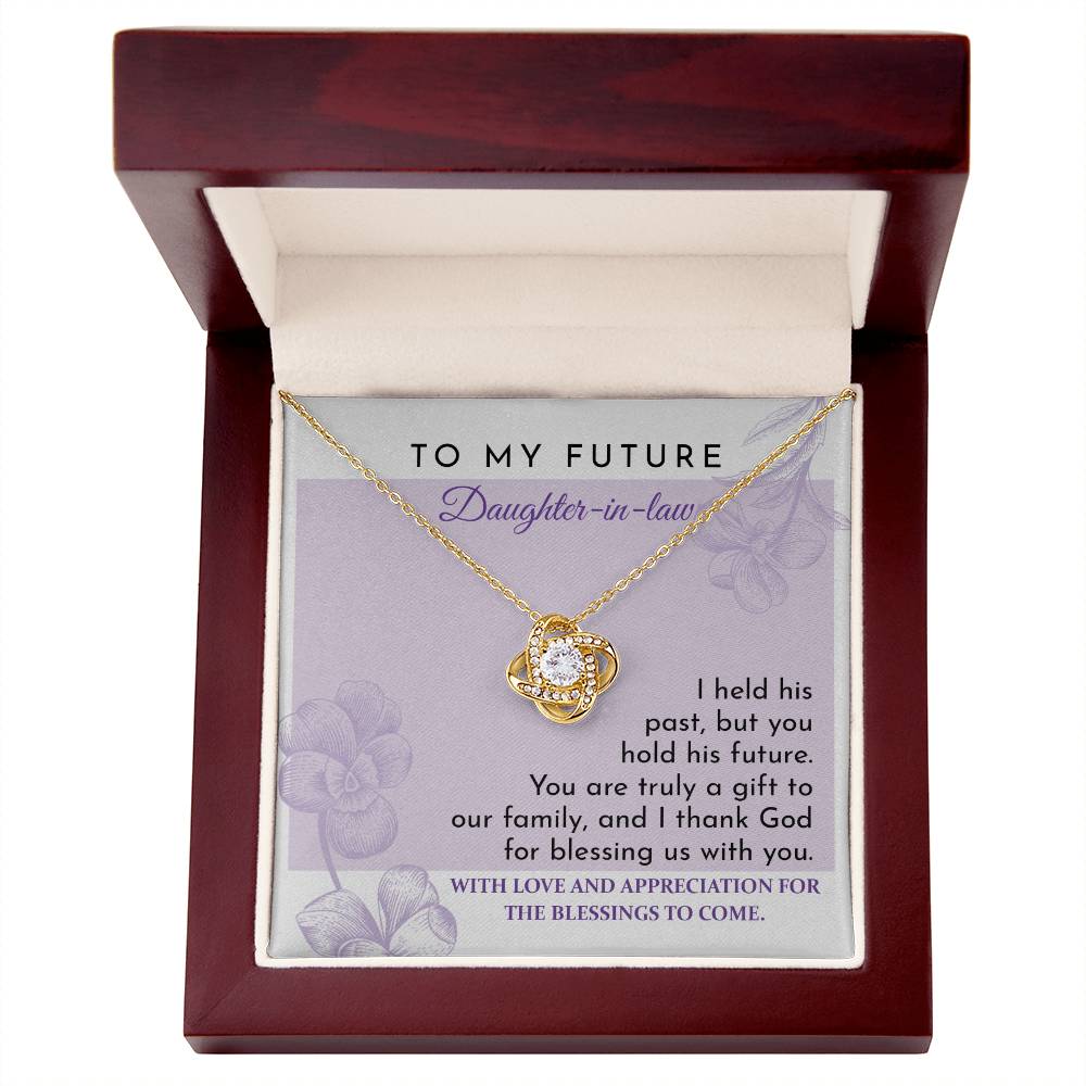 To Daughter-in-law, A Gift - Love Knot Necklace with an intertwined pendant, set against a card reading "To My Future Daughter-in-law," and an appreciation message expressing gratitude and blessings for the future. Decorated with shimmering cubic zirconia, this piece is a glowing testament to your welcome into the family.