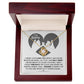 The Sorry-Hurtful Words Love Knot Necklace is displayed on a card featuring an illustration of a heart and hands. The card conveys an apology message that expresses deep regret and a promise to make amends. This personalized gift is adorned with cubic zirconia, symbolizing the depth of sincerity and commitment.
