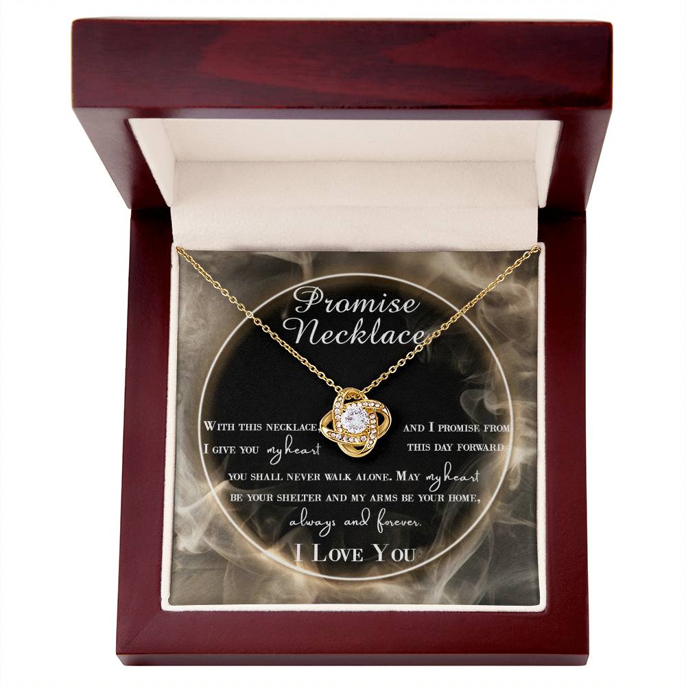 A To Wife, Promise Necklace - Love Knot Necklace with interlocking hearts, adorned with small cubic zirconia crystals and a gold finish, displayed in a box with a romantic message.