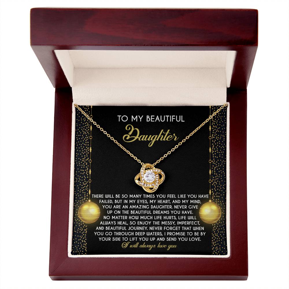 Explore the Daughter-Deep Waters - Love Knot Necklace, a breathtaking gold accessory embellished with cubic zirconia crystals. Presented in an exquisite wooden box, it holds a sincere message for a daughter, offering love and encouragement. This customizable gift is accompanied by an elegantly designed card filled with heartfelt words.