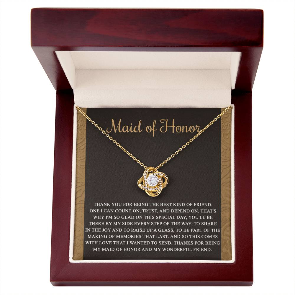 The "To Maid of Honor, Kind Of Friend - Love Knot Necklace" features an intertwined knot design adorned with cubic zirconia crystals on a background that reads "Maid of Honor," followed by a heartfelt thank you message to the maid of honor.