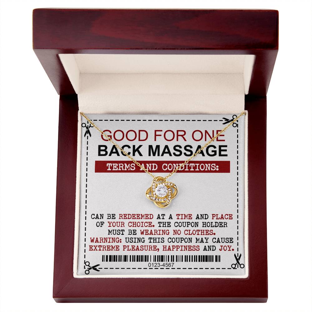 A silver To Wife, Back Massage - Love Knot Necklace with a pendant rests on a voucher stating it is good for one back massage, with conditions including choosing the time and place, and the coupon holder must be unclothed.