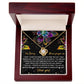 The Sorry-All My Heart - Love Knot Necklace features an interlocking heart pendant on a card with vibrant succulent graphics and the message: "I'm Sorry, Please forgive me. I love you." Adorned with sparkling cubic zirconia crystals, this necklace is available in a choice of white gold or yellow gold finish.