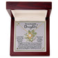 The "Daughter-Incredible Woman - Love Knot Necklace" features a circular pendant adorned with cubic zirconia crystals and comes in a wooden box with a white interior lining. Inside, a heartfelt message addresses the daughter, expressing love and pride from the sender. The pendant is elegantly crafted in 14k white gold.