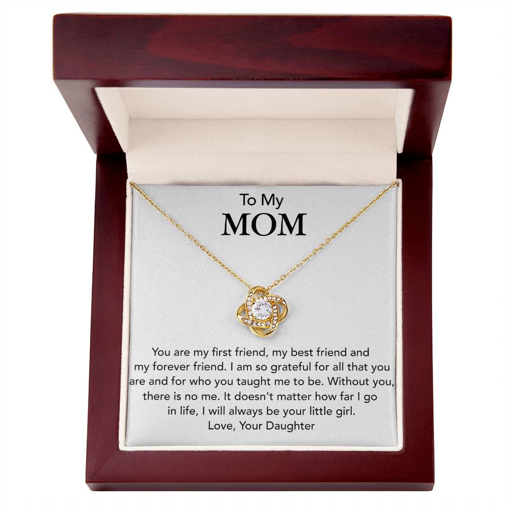 A To My Mom, You Are My First Friend - Love Knot Necklace with a circular pendant, adorned with cubic zirconia crystals, displayed in a gift box, which includes a sentimental message to a mother from a daughter by ShineOn Fulfillment.