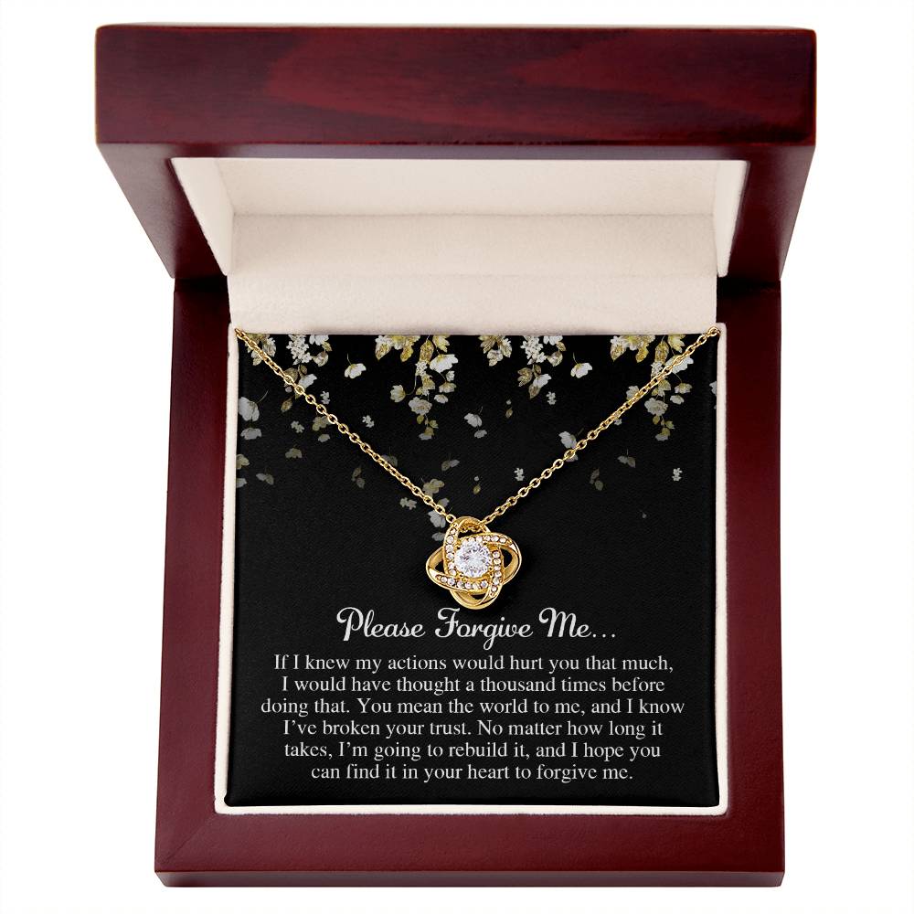 A Sorry-Broken Your Trust - Love Knot Necklace with cubic zirconia crystals and a white gold finish, presented in a red box with the inscription "Please Forgive Me" and an apology message.