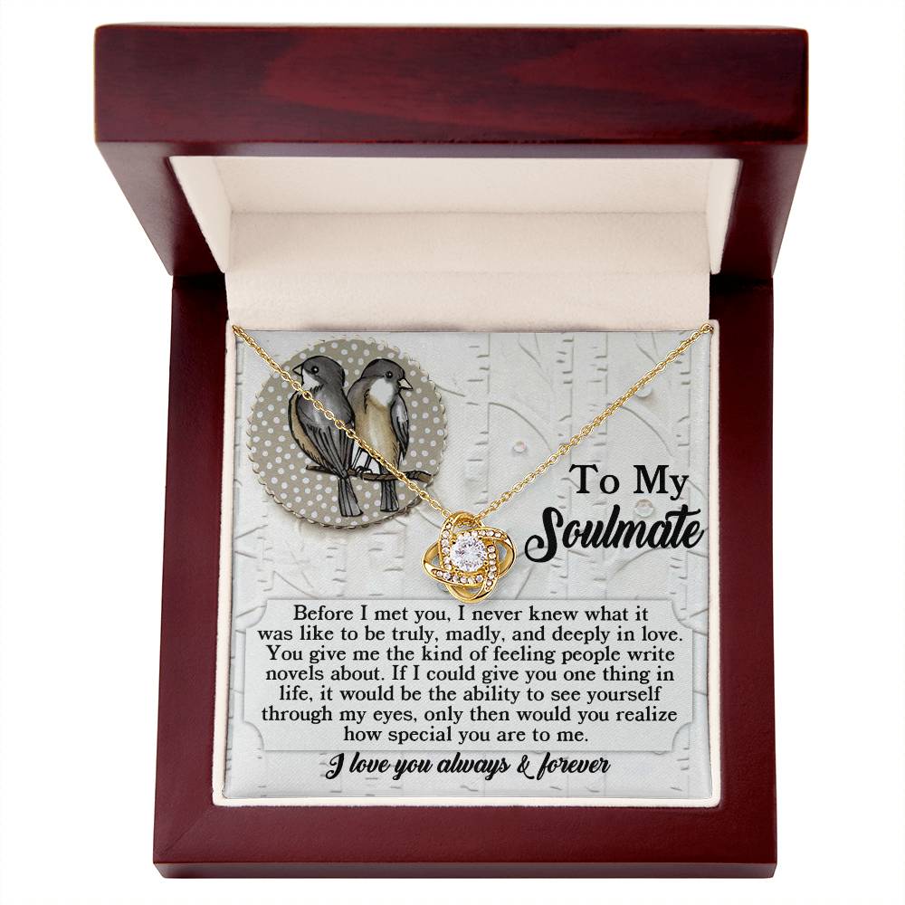 The Soulmate-Write Novels - Love Knot Necklace, embellished with Cubic Zirconia Crystals, is gracefully presented in a wooden box. Within, a message card states: "To My Soulmate," along with an expressive note on love and devotion, accentuated by the necklace's breathtaking gold finish.